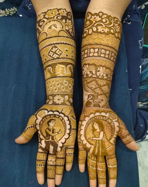 figure full hand mehndi design