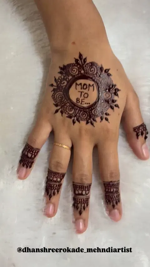 aesthetic simple circle back hand mehndi design