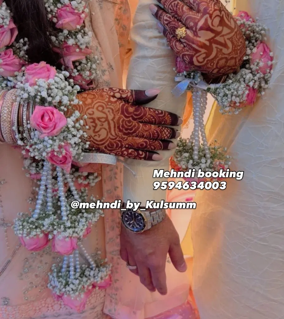 Back Hand Mehndi Design with Figures and Hearts
