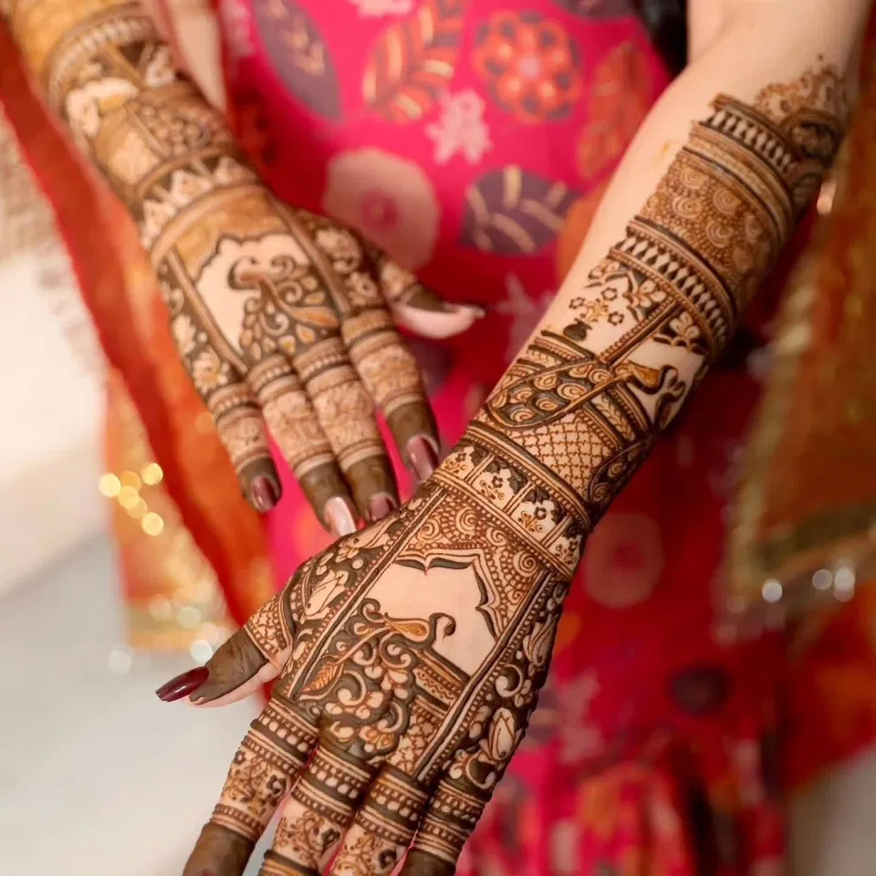 Bridal Back Hand Mehndi Design with Figures and Flowers