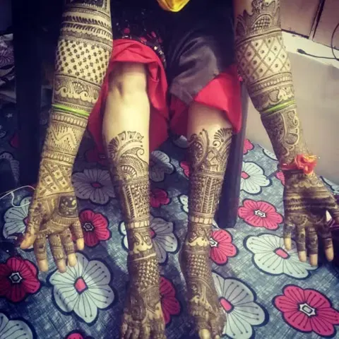 figure full hand mehndi design