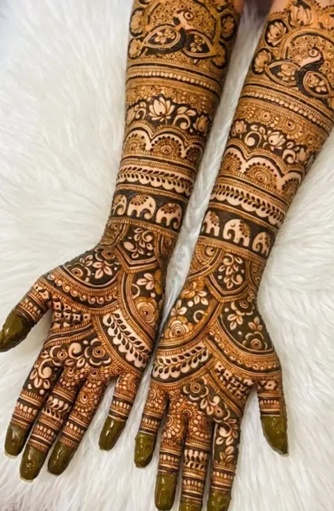 figure full hand mehndi design