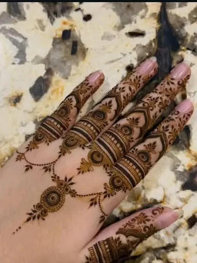 aesthetic royal deity back hand mehndi design