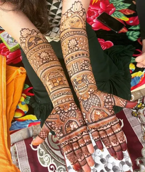 figure full hand mehndi design
