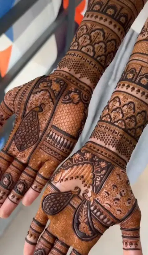 figure full hand mehndi design