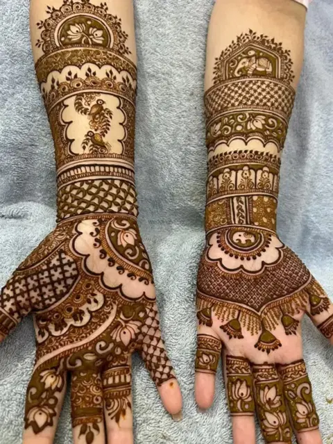 figure full hand mehndi design
