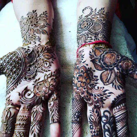figure full hand mehndi design