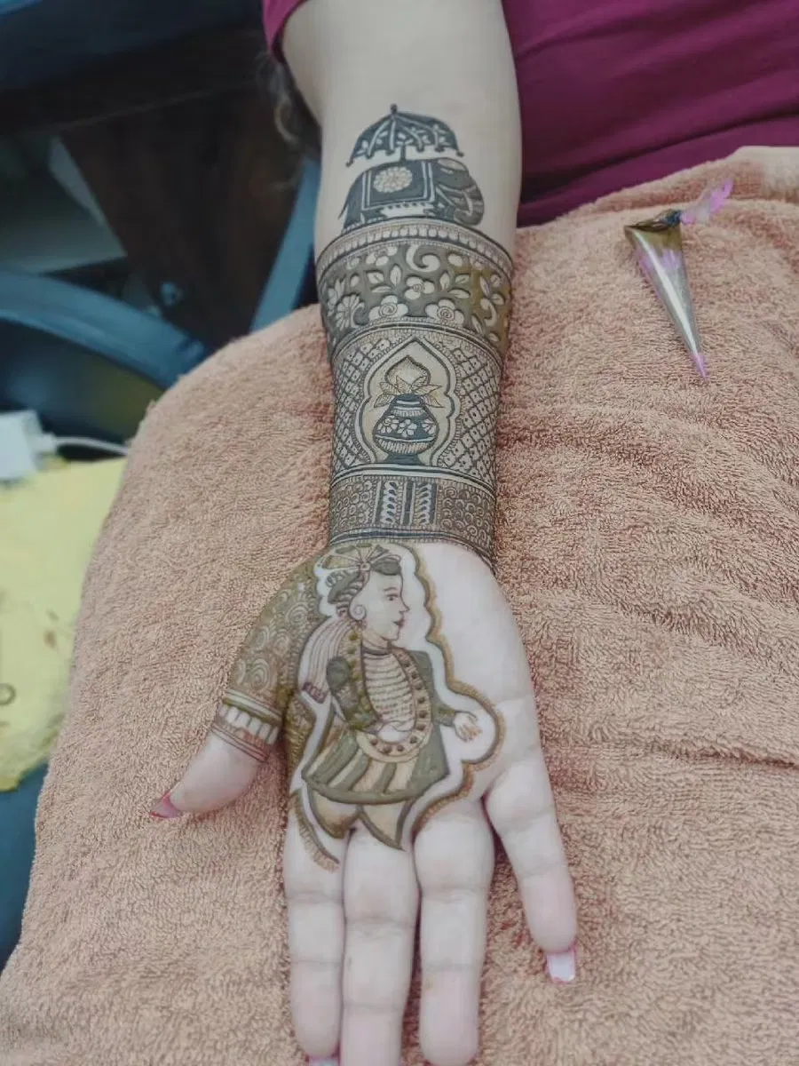 Back Hand Mehndi Design with Figures