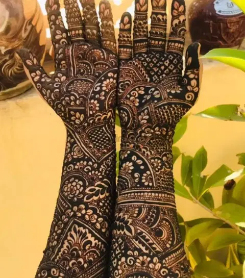 figure full hand mehndi design