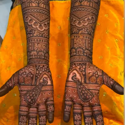 figure full hand mehndi design