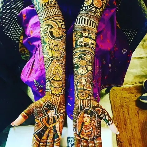 figure full hand mehndi design