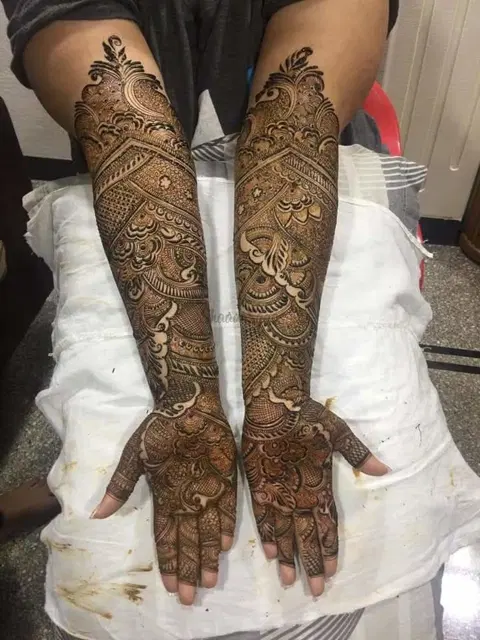 figure full hand mehndi design