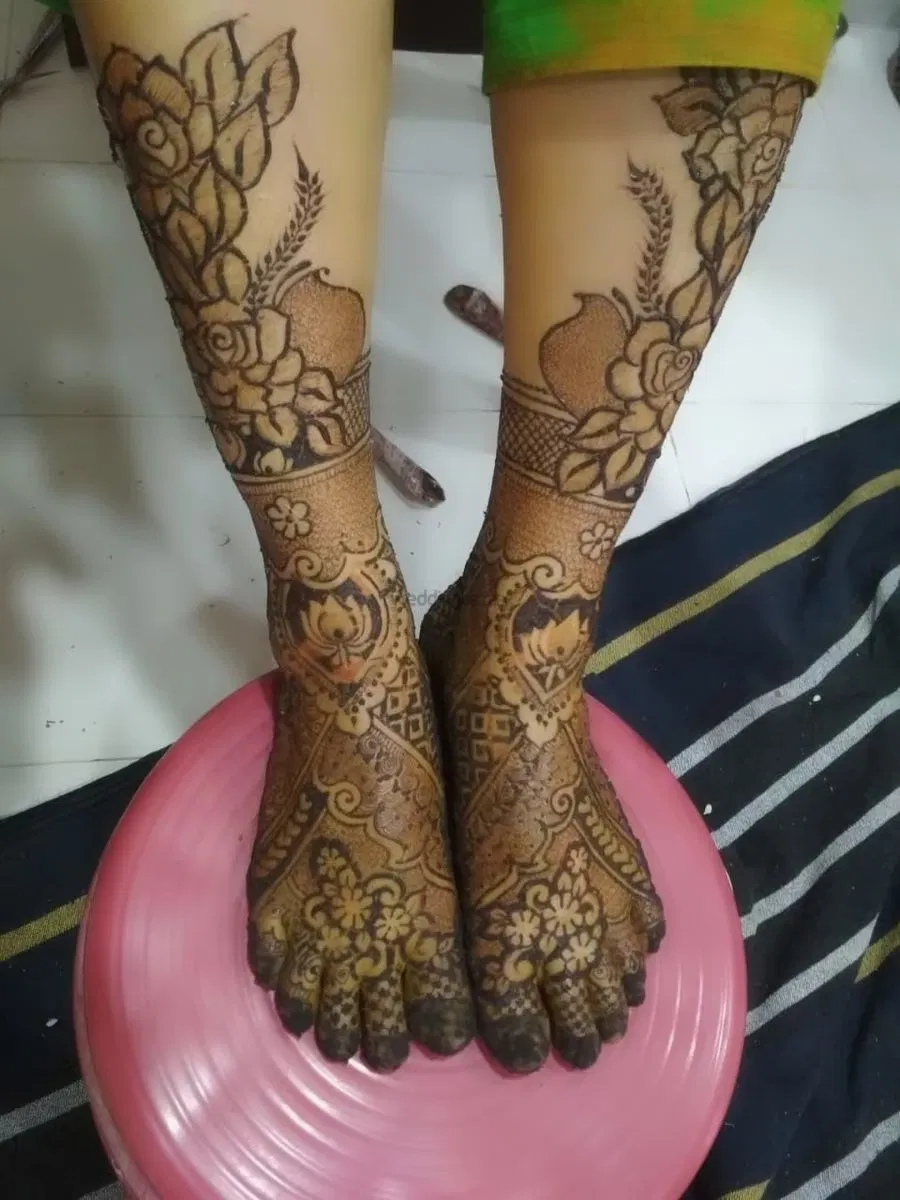 Back Hand Mehndi Design with Figures and Lotus