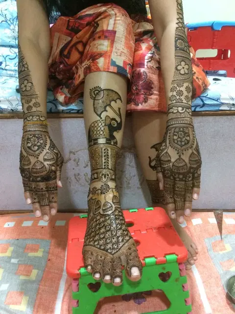 figure full hand mehndi design