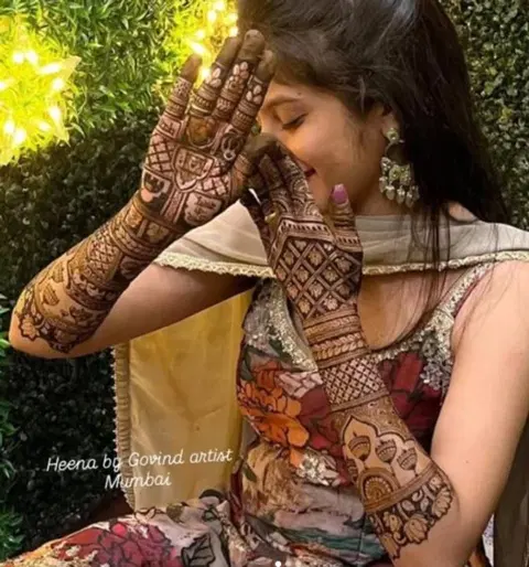 figure full hand mehndi design