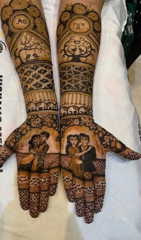 figure full hand mehndi design
