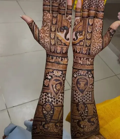 figure full hand mehndi design