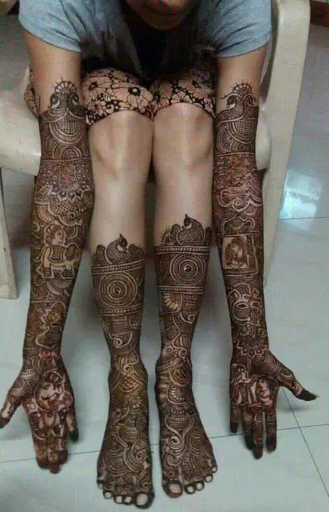 figure full hand mehndi design