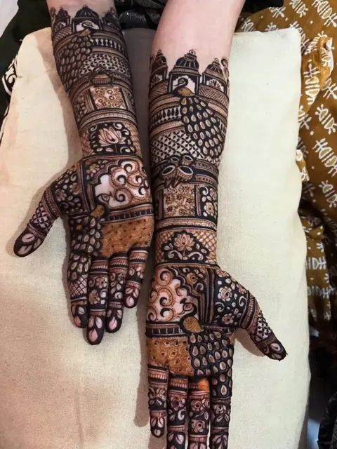 figure full hand mehndi design
