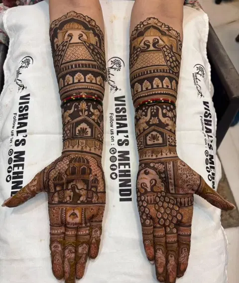 figure full hand mehndi design