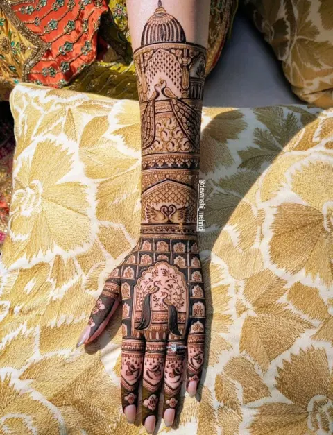 bridal royal figure back hand mehndi design