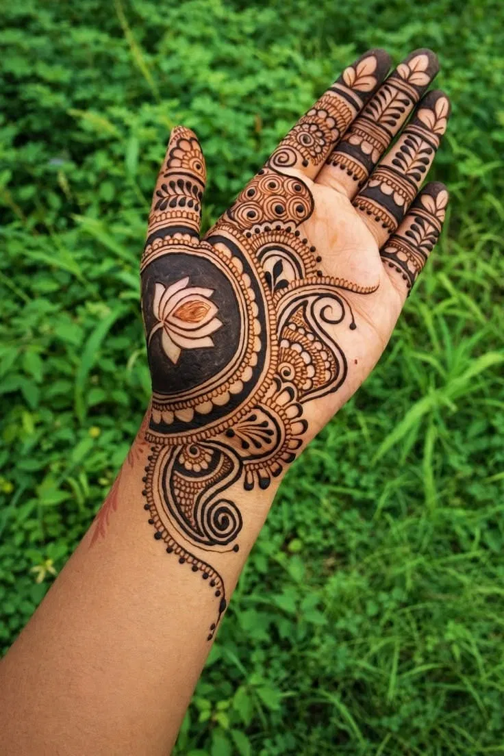 Aesthetic Bridal Front Hand Mehndi Design with Gol Tikki, Lotus and Peacock for Raksha Bandhan