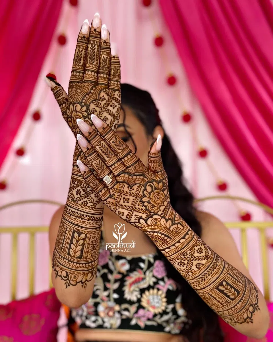Bridal Stylish Back Hand Mehndi Design with Figures, Hearts and Lotus
