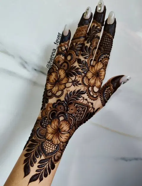 aesthetic minimal flower back hand mehndi design