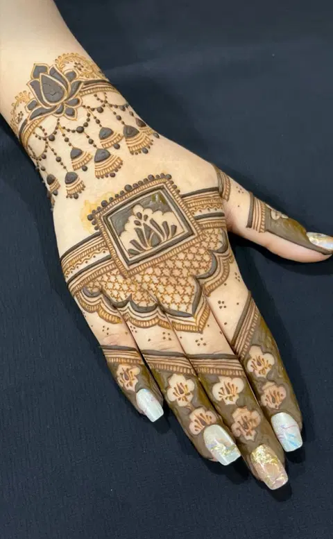 aesthetic bridal flower back hand mehndi design