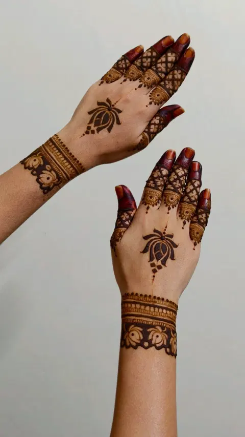 aesthetic minimal flower back hand mehndi design