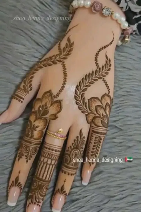 aesthetic arabic lotus back hand mehndi design