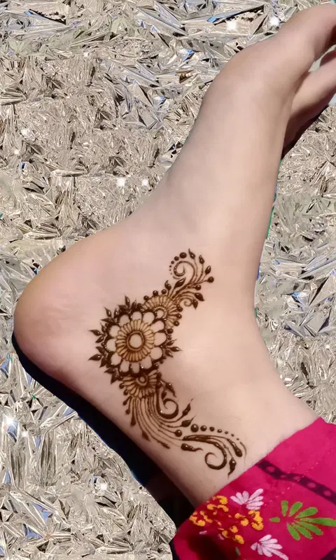 arabic minimal deity foot mehndi design