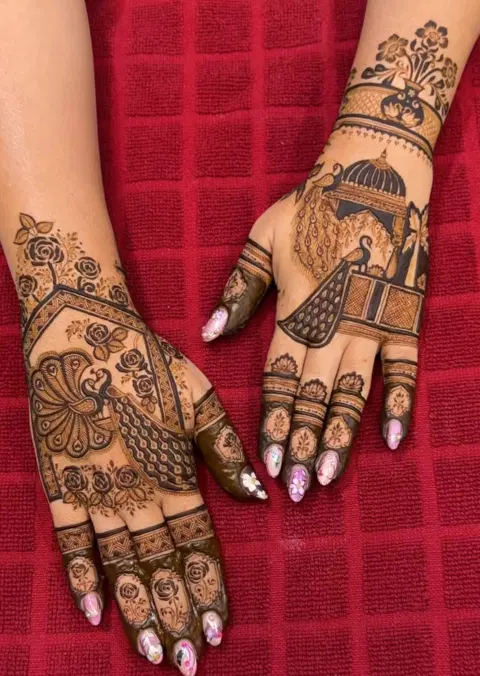 bridal indian figure back hand mehndi design