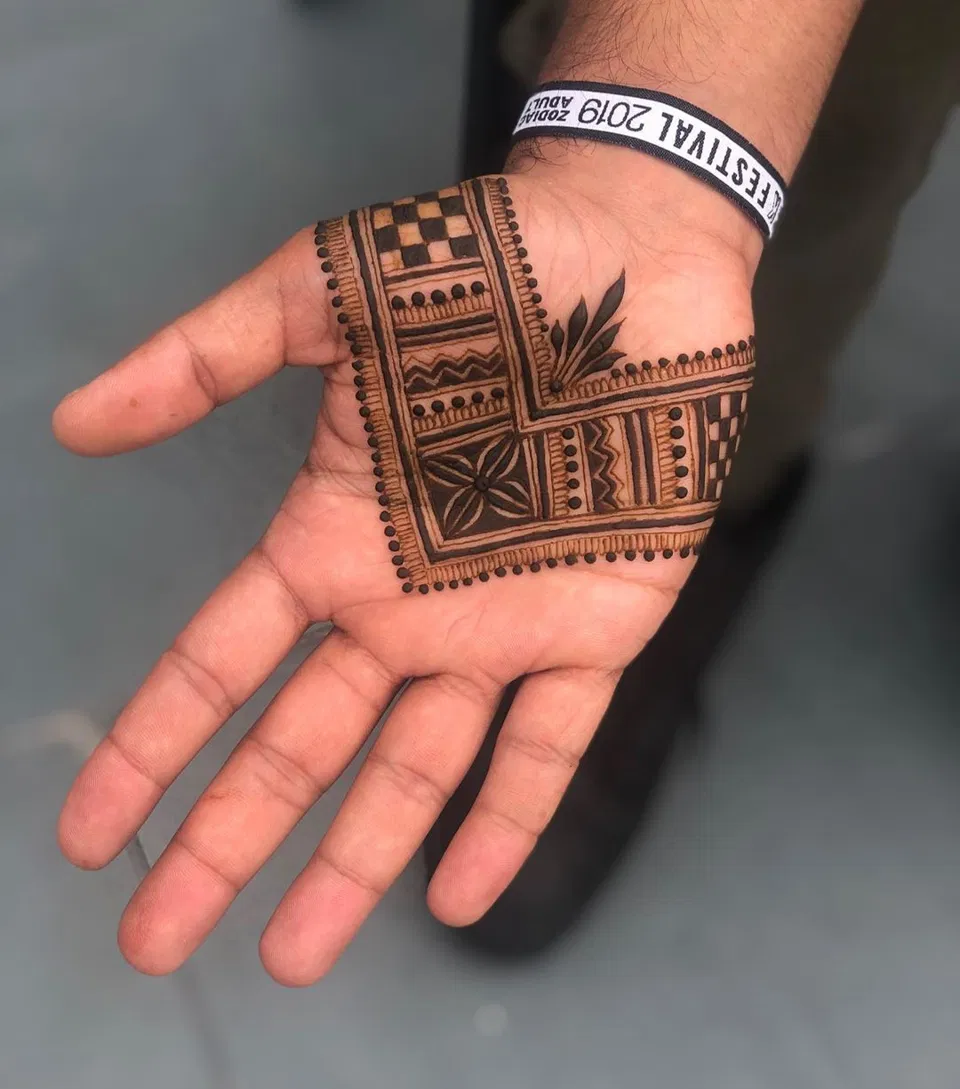 Simple Back Hand Mehndi Design with Gol Tikki and Deity