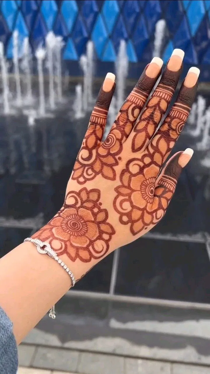 Aesthetic Simple Back Hand Mehndi Design with Bel, Gol Tikki and Flowers