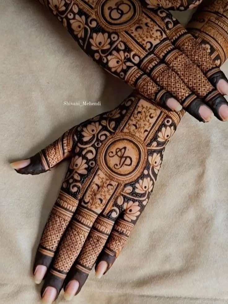 Bridal Stylish Back Hand Mehndi Design with Gol Tikki, Deity and Hidden Name for Engagement
