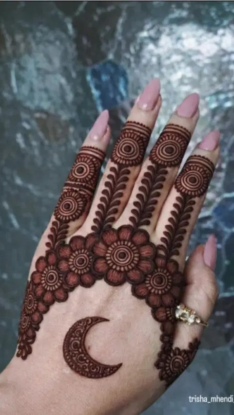 aesthetic moon back hand mehndi design
