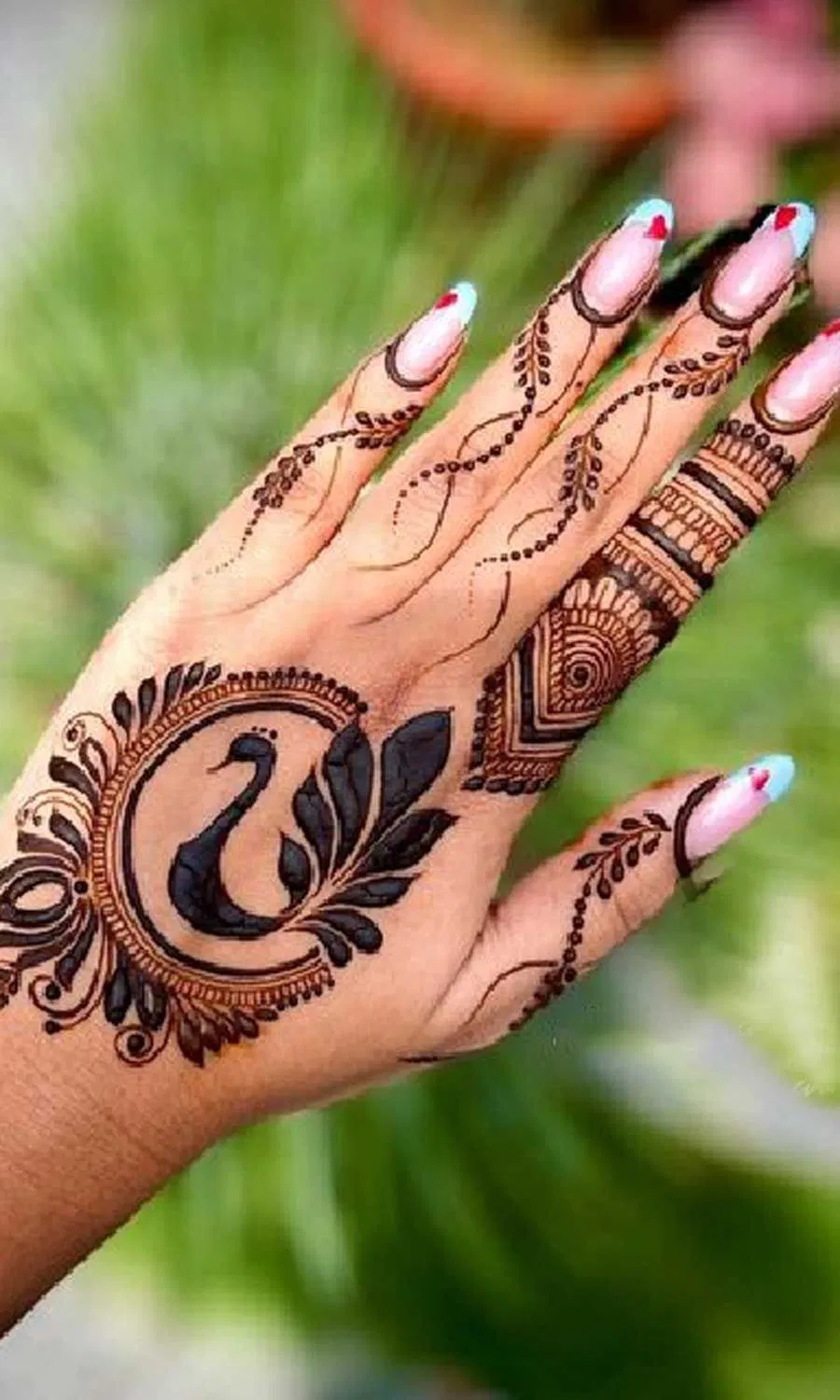 Aesthetic Royal Back Hand Mehndi Design with Peacock