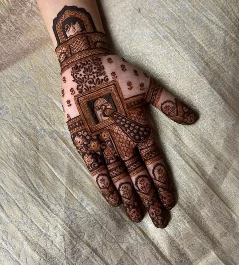bridal royal figure back hand mehndi design