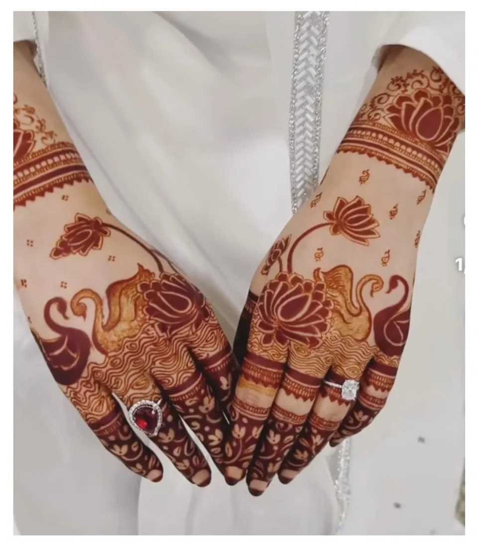 Aesthetic Bridal Back Hand Mehndi Design with Hearts and Lotus