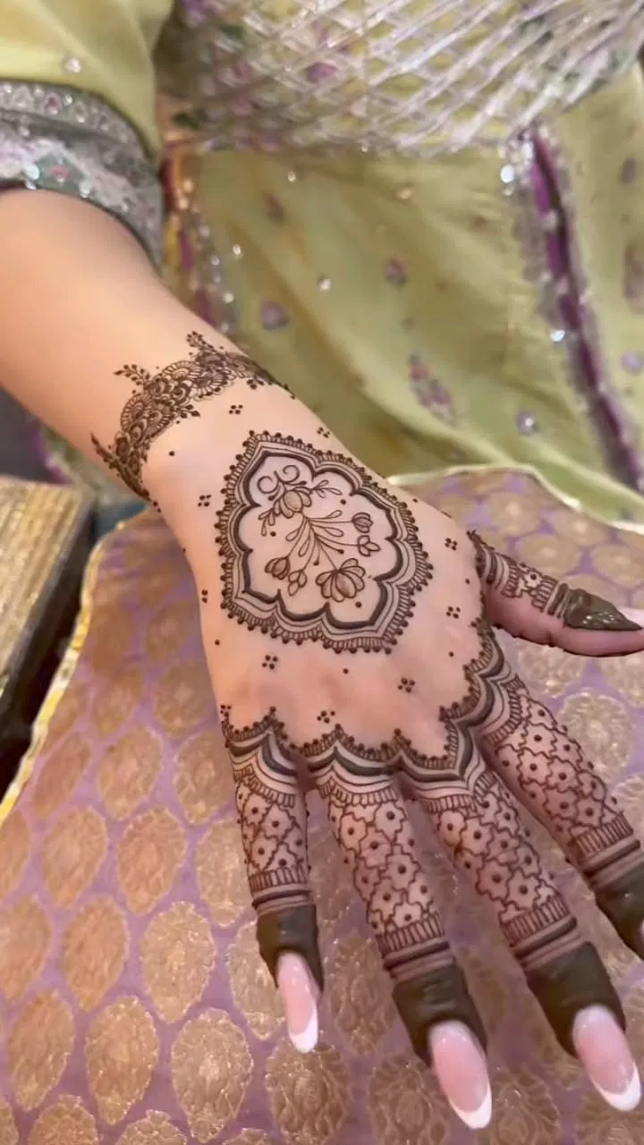 Aesthetic Bridal Arm Mehndi Design with Gol Tikki