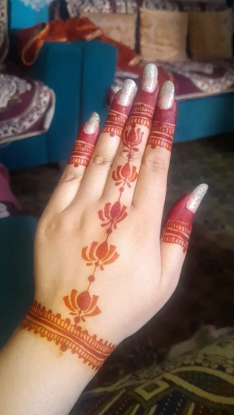 aesthetic indian flower back hand mehndi design