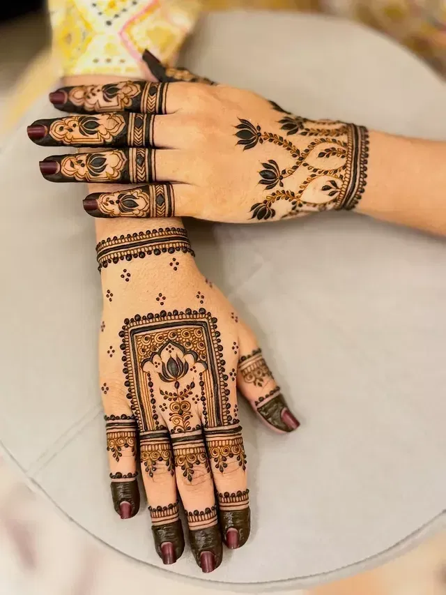 Aesthetic Bridal Back Hand Mehndi Design with Gol Tikki, Deity and Lotus