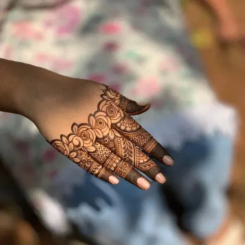 aesthetic royal flower back hand mehndi design