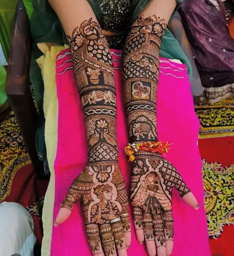 bridal figure back hand mehndi design