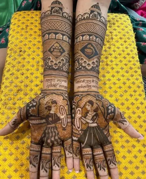 bridal stylish deity back hand mehndi design