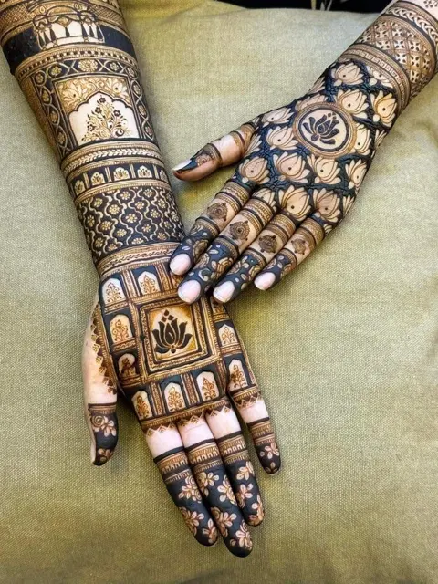 bridal indian figure back hand mehndi design