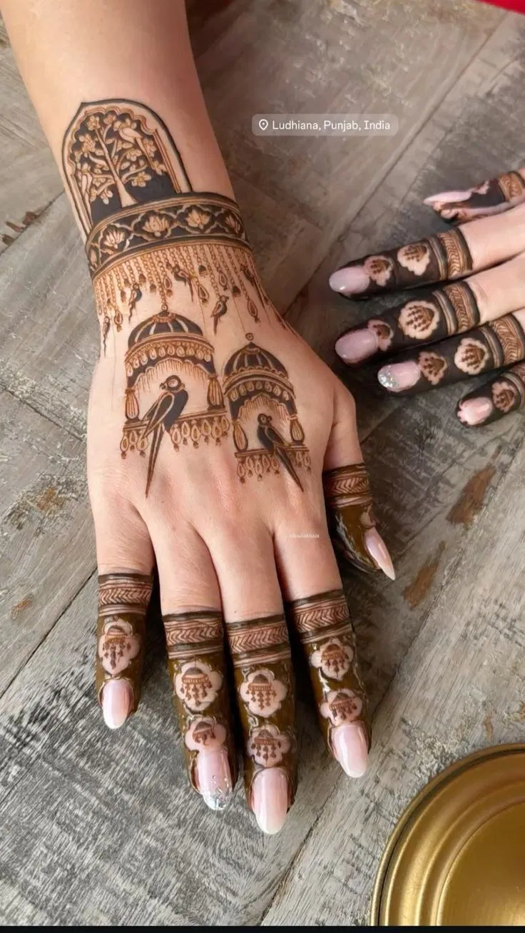 Aesthetic Bridal Back Hand Mehndi Design with Figures, Jaal and Peacock for Engagement