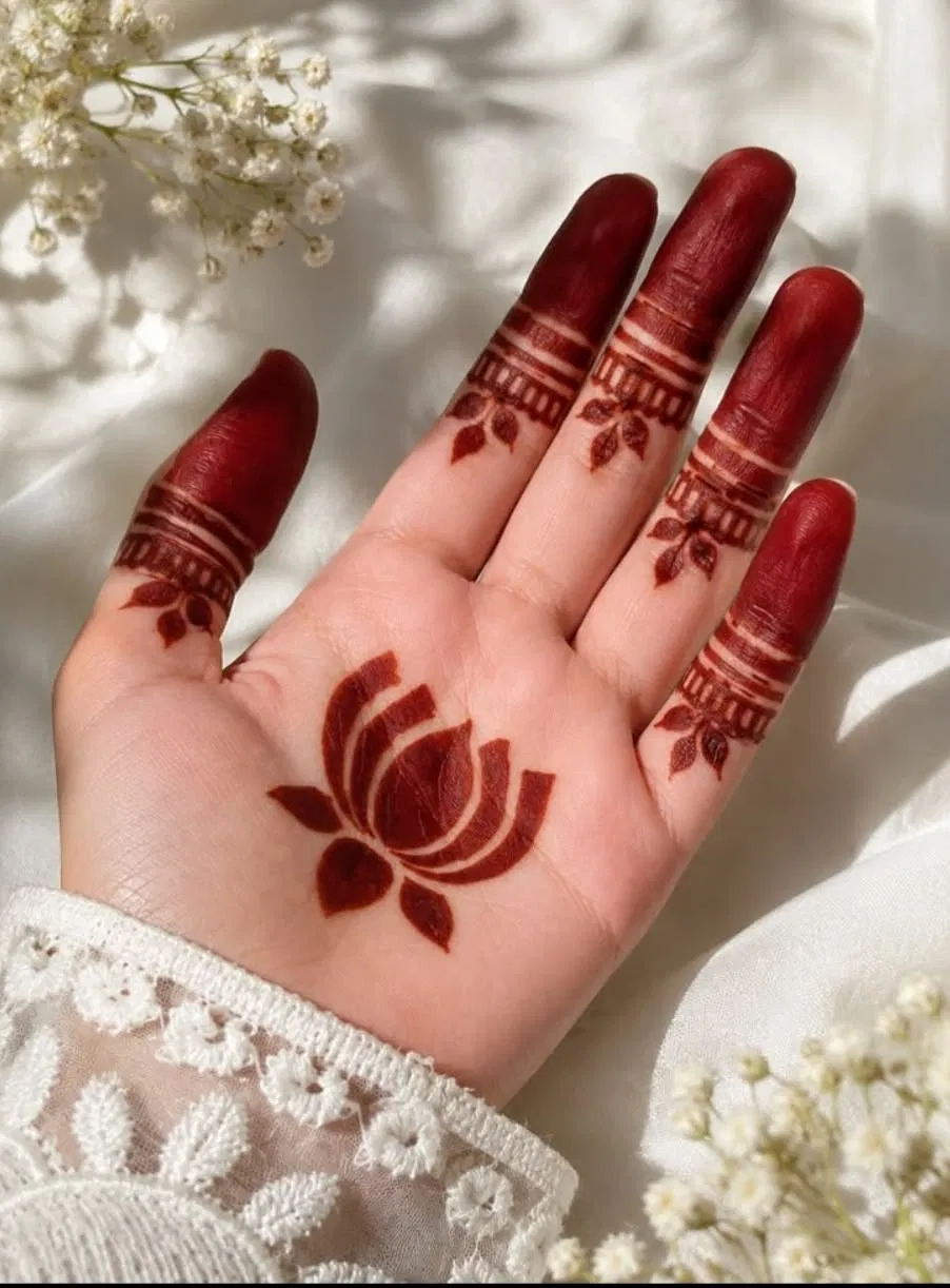 Aesthetic Minimal Back Hand Mehndi Design with Gol Tikki, Flowers and Lotus for Diwali (5)