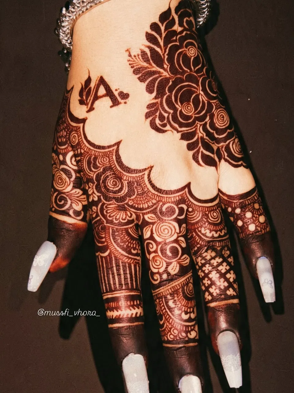 Aesthetic Arabic Back Hand Mehndi Design with Flowers and Hidden Name